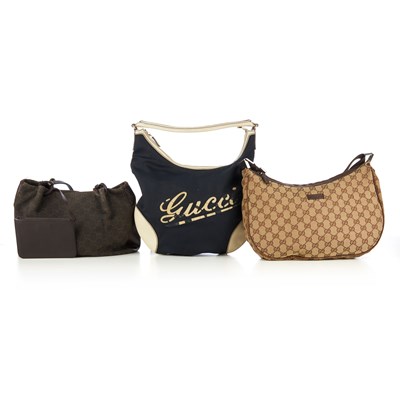 Lot 329 - Gucci, three handbags, to include a classic GG...