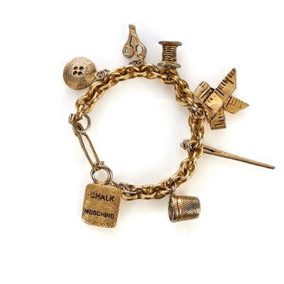 Lot 375 - Moschino, a vintage charm bracelet, featuring...