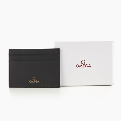 Lot 381 - Omega, a black leather card wallet, featuring...