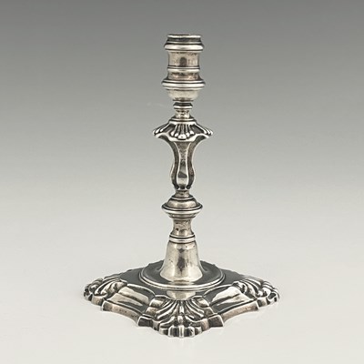 Lot 302 - A George II silver cast taperstick, the...