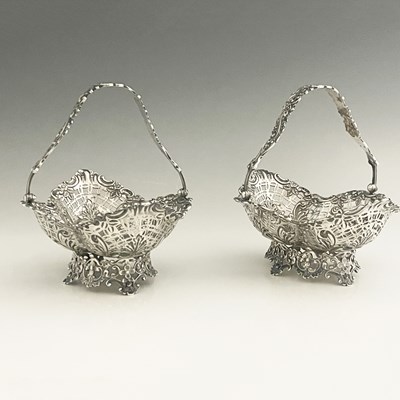 Lot 311 - A pair of Victorian silver swing handle...