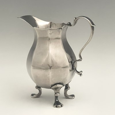 Lot 312 - A George II silver octagonal cream jug, the...