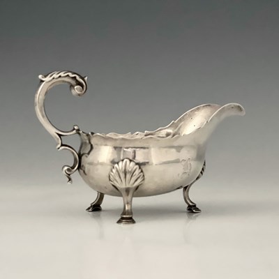 Lot 317 - A George III silver sauce boat, with wavy-edge...