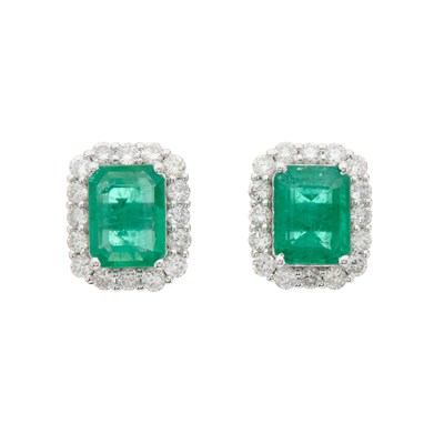Lot 28 - A pair of 18ct gold emerald and brilliant-cut...