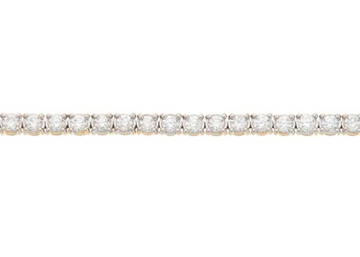 Lot 32 - An 18ct gold brilliant-cut diamond line...