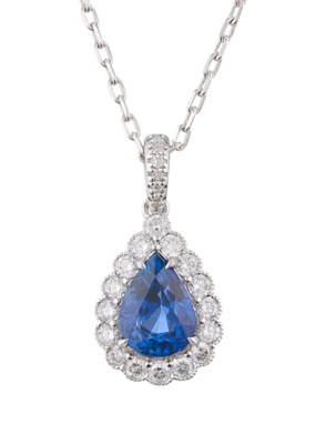 Lot 33 - An 18ct gold pear-shape sapphire and brilliant-...