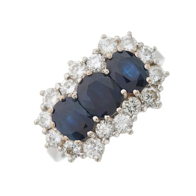 Lot 34 - An 18ct gold sapphire three-stone and...