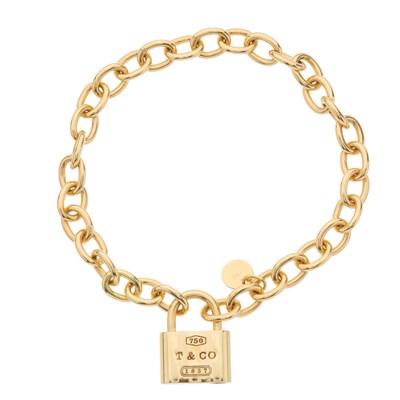 Lot 58 - Tiffany & Co., an 18ct gold 1837 Padlock Charm...