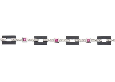 Lot 65 - An 18ct gold onyx, square-shape ruby and...