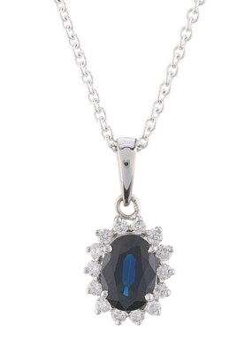 Lot 117 - An 18ct gold oval-shape sapphire and brilliant-...