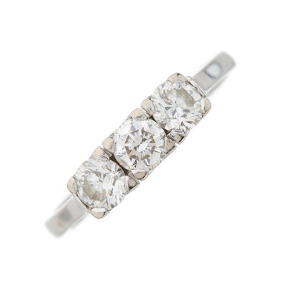 Lot 128 - A brilliant-cut diamond three-stone ring, with...