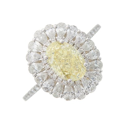 Lot 174 - A platinum oval-shape Fancy Yellow diamond and...