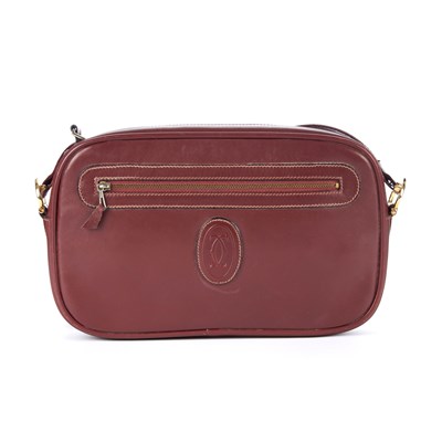 Lot 261 - Cartier, a vintage Bordeaux leather camera bag,...