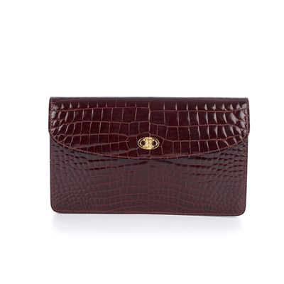 Lot 263 - Celine, a crocodile embossed leather clutch,...