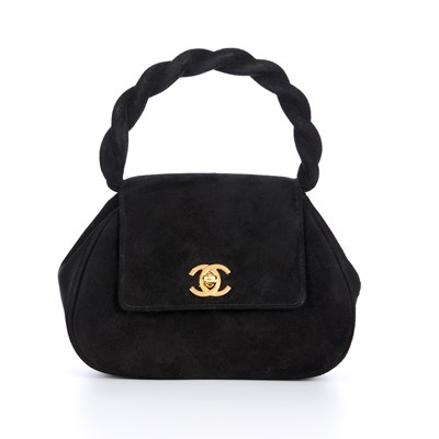 Lot 278 - Chanel, a small vintage black suede twisted...