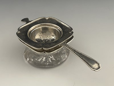 Lot 16 - An American sterling silver tea strainer and...