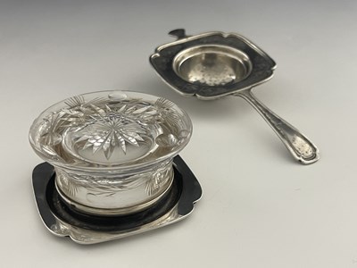 Lot 16 - An American sterling silver tea strainer and...